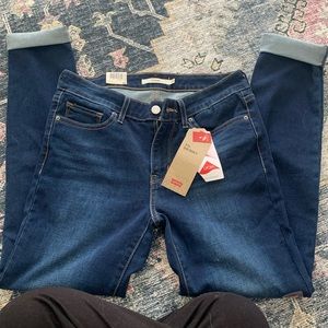 Levi’s 711 mid rise skinny jeans, 29X 30 medium wash